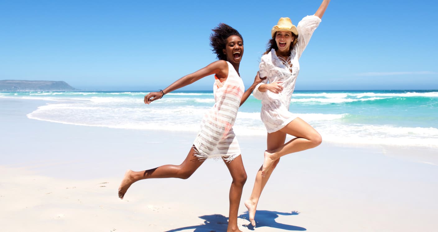 Two people celebrating on the beach