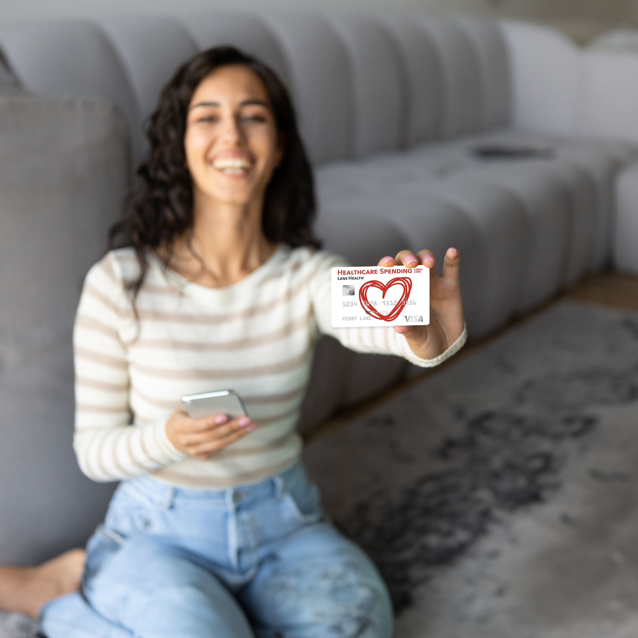 Woman holding the Healthcare Spending Card